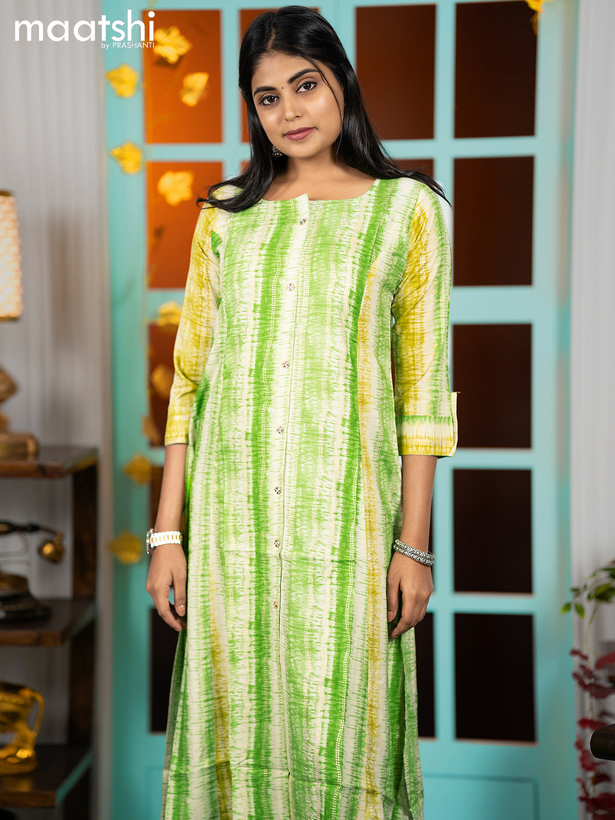 Rayon readymade A-line kurti green and lime green with allover batik prints & simple neck pattern without pant