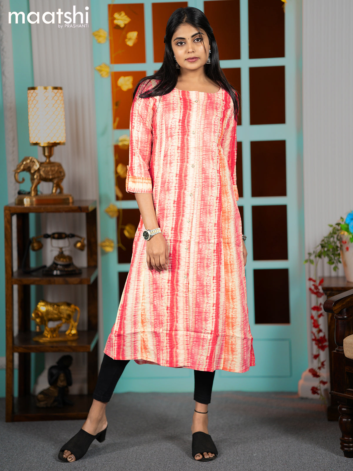 Rayon readymade A-line kurti peach pink and orange with allover batik prints & simple neck pattern without pant