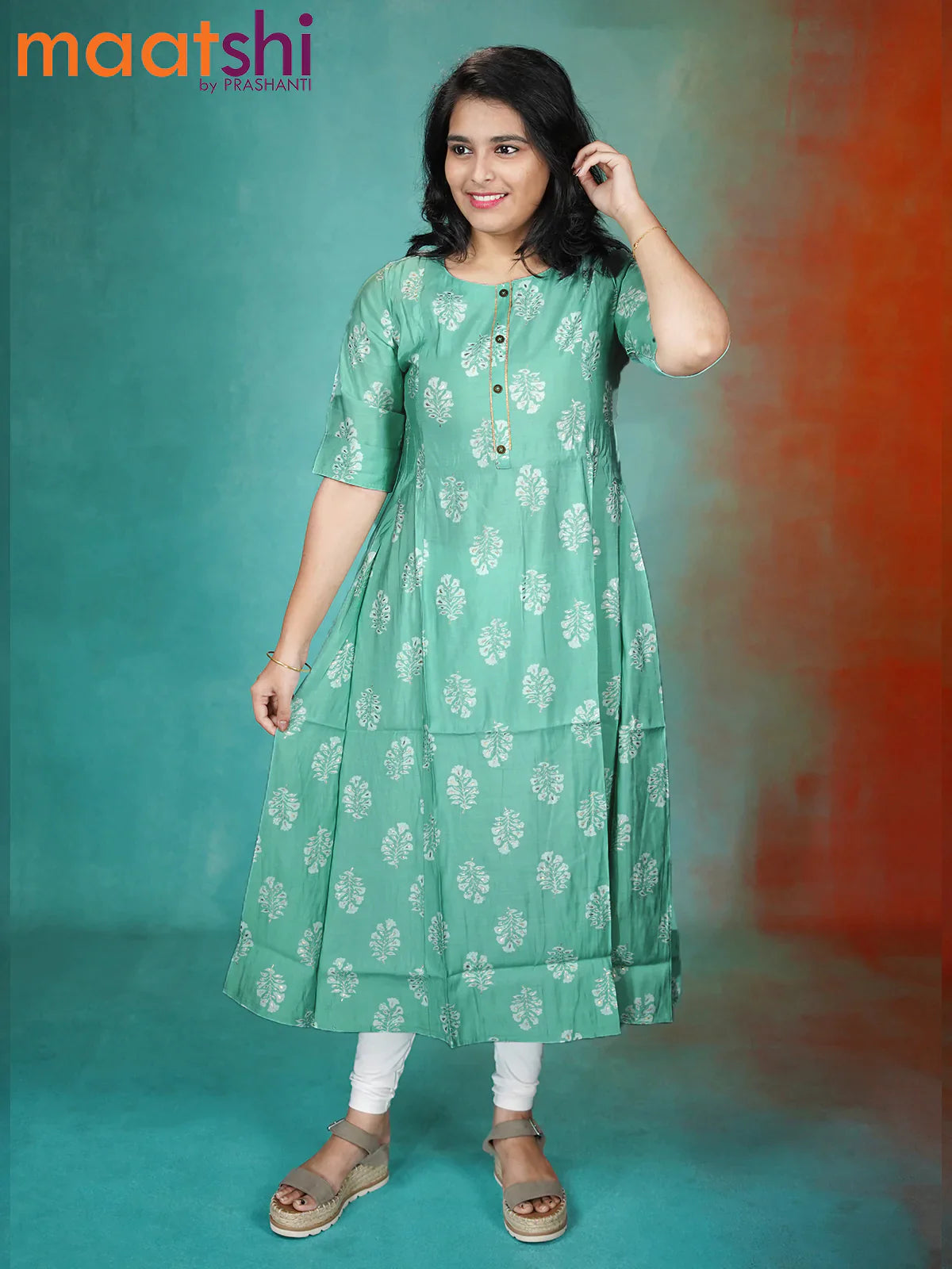 Muslin readymade kurti pastel green shade with allover floral prints & simple patch work neck pattern without pant